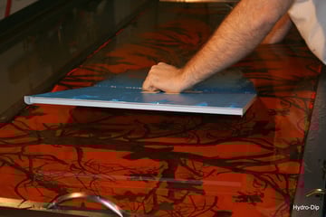 Hydro dipping a plate in a dipping tank