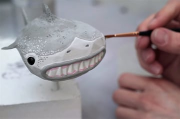 Using acrylic paint and a paintbrush