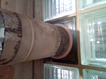 This dryer vent fitting through a glass block window helps prevent drafts from coming in where the pipe was originally set