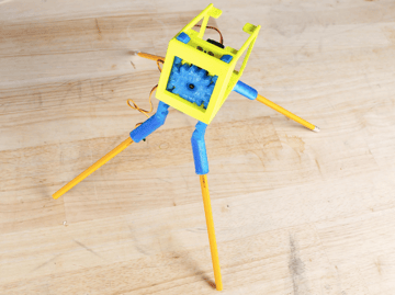 Ten czterokołowy robot ma ołówki jak nogi