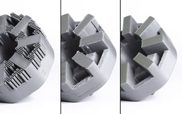 A PLA print in three stages of having supports removed