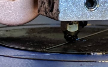A dirty nozzle can cause material to stick to its exterior