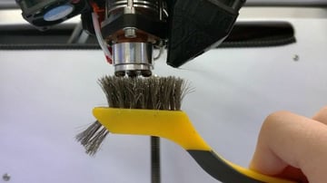 You can use a wire brush to clean the exterior of the nozzle