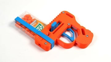 The toy includes a ticTACtical candy box strap