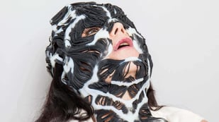 Featured image of Björk Wears 3D Printed Rottlace Mask for Live Performance