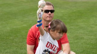 Featured image of Girl with 3D Printed Hand Throws First Pitch at Game 4 of World Series