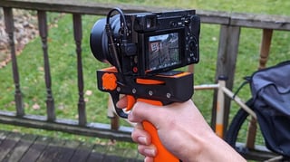 Featured image of 3D Printable Photopistol Upgrades Your Camera With ‘Literal Point-And-Shoot’ Capability