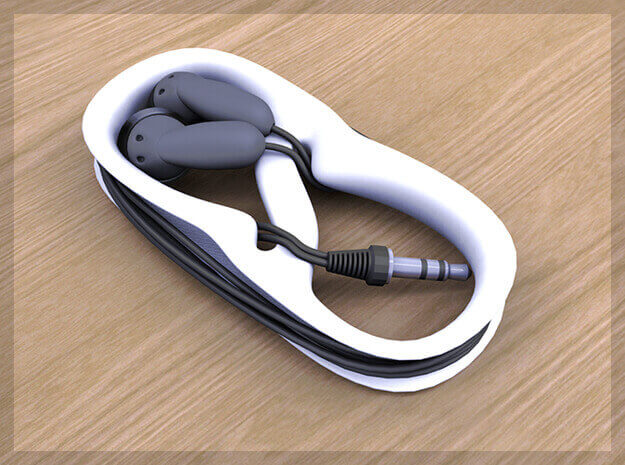 The Earphones MP3 Cable Winder in white plastic (source: Shapeways)