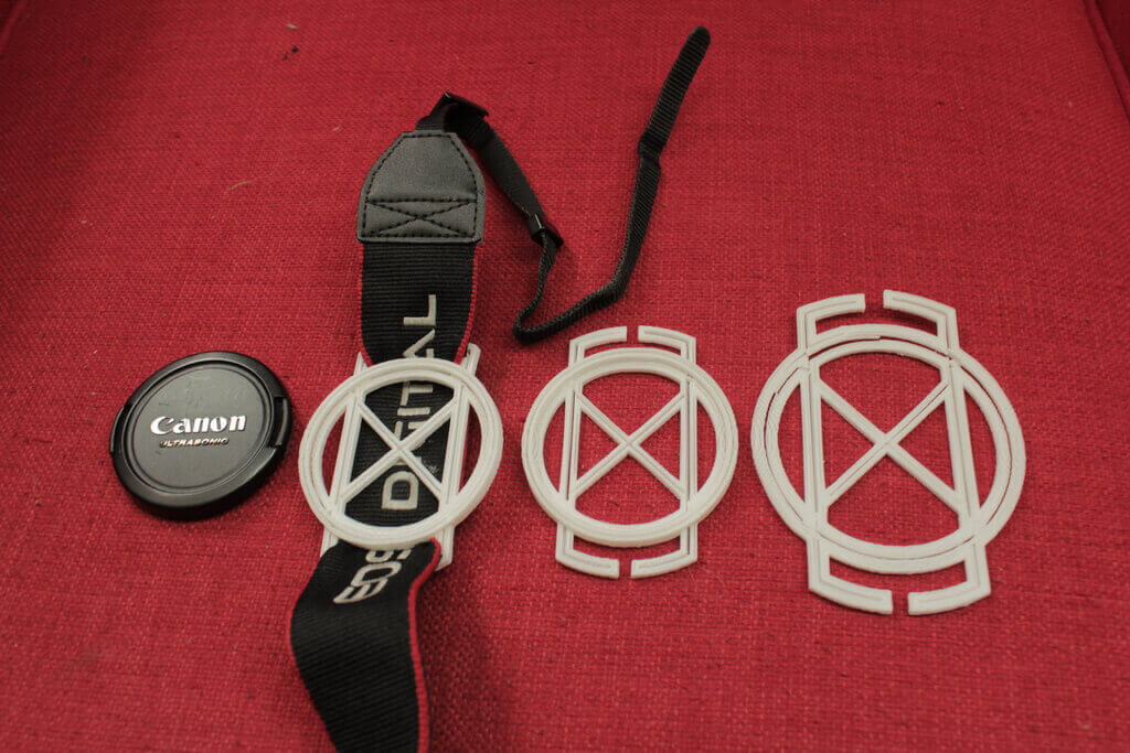 Three different sizes of the camera lens cap holder