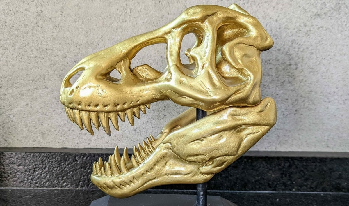 Transform your T-Rex skull with gold spray paint