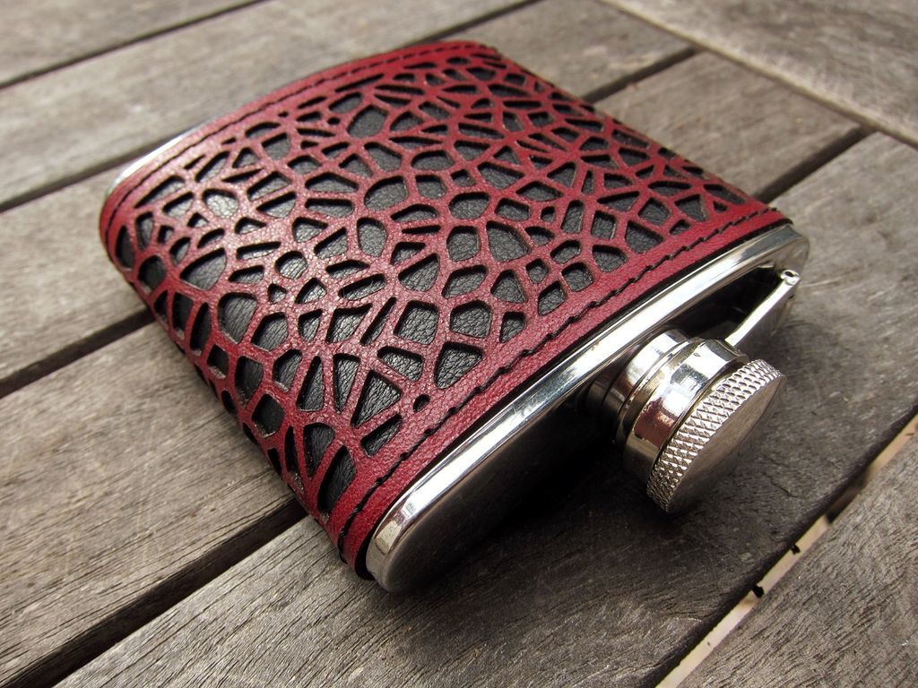 A flask covered with laser-cut leather.