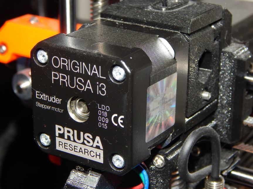 The extruder motor on a Prusa i3 MK3 is known to get quite hot during use.