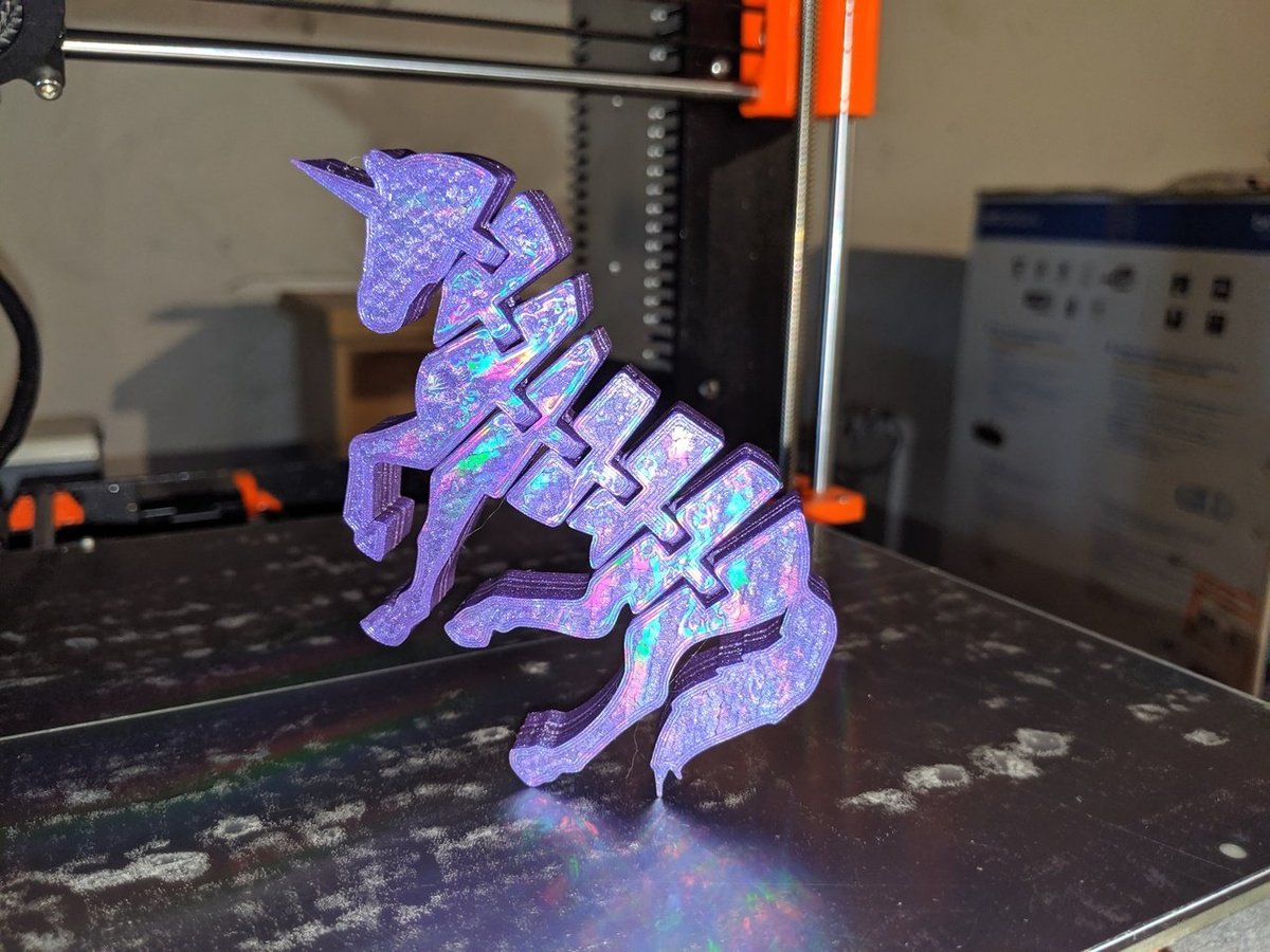 This unicorn was printed on a diffraction grating sheet to obtain that shiny rainbow appearance