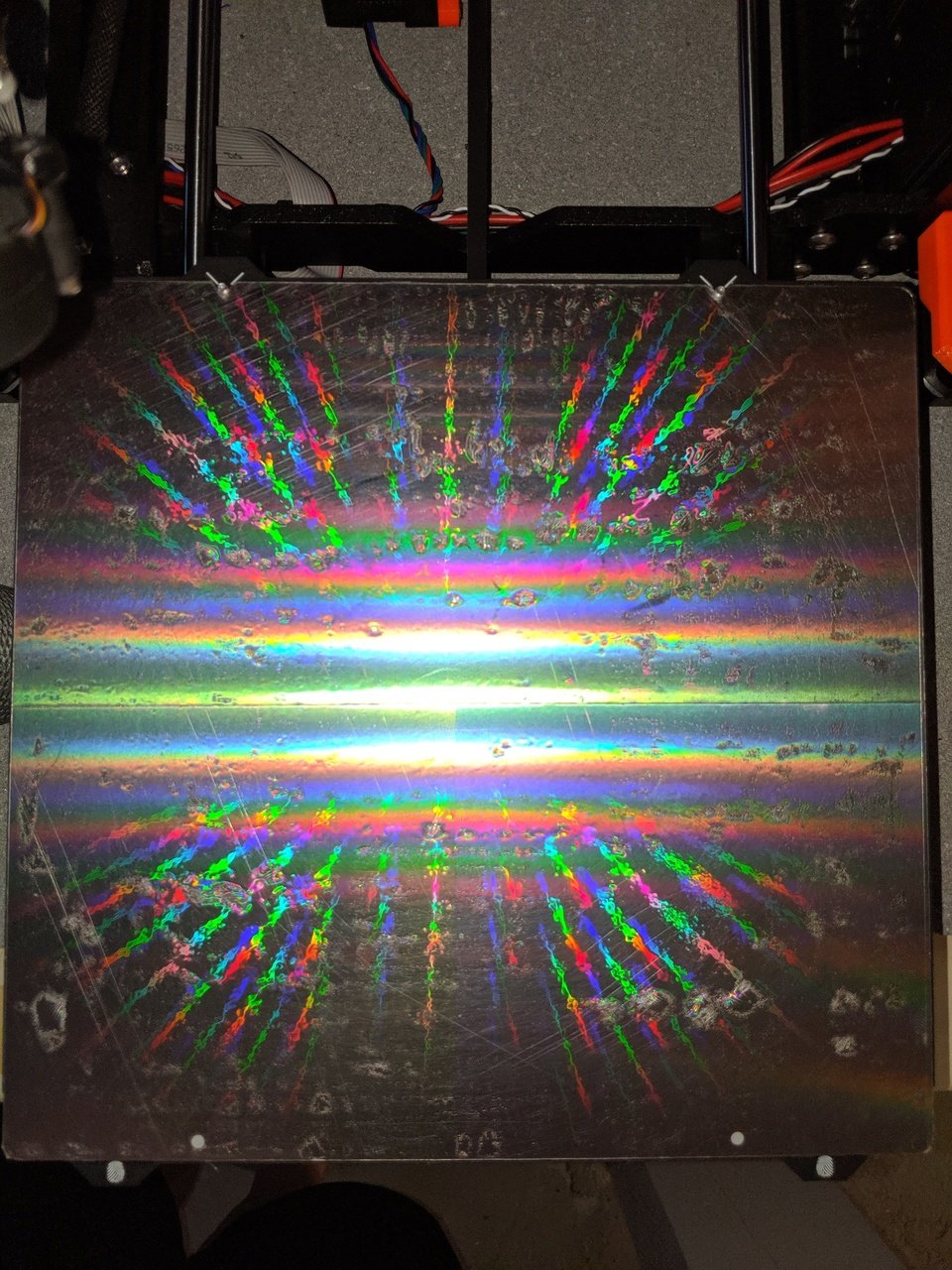 Applying a plastic diffraction grating surface to a build plate
