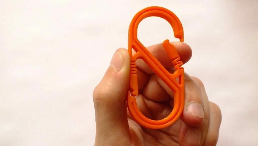 This useful S-carabiner has bendable arms to attach what you need