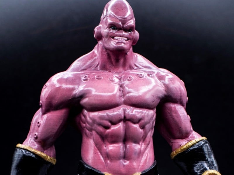 Super Buu is the product of Evil Buu eating Good Buu, which why he's not so gray as Evil Buu