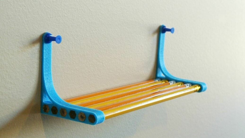 You can make this shelf with just some pencils and thumbtacks
