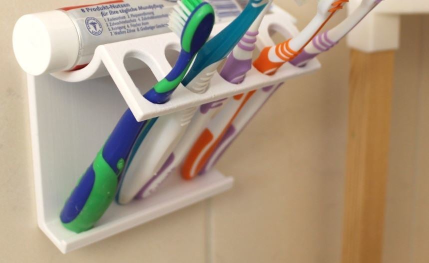 This convenient design can hold up to five toothbrushes and a tube of toothpaste