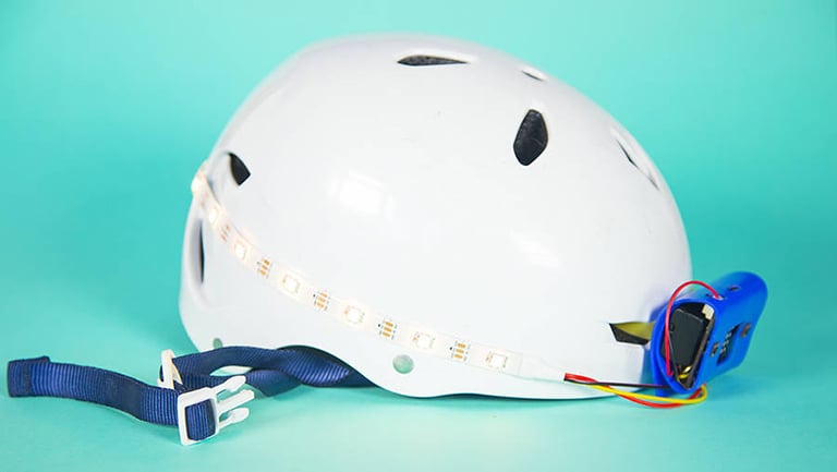 Turn your bike helmet into a light-up helmet with the Micro:Bit's built-in LED matrix