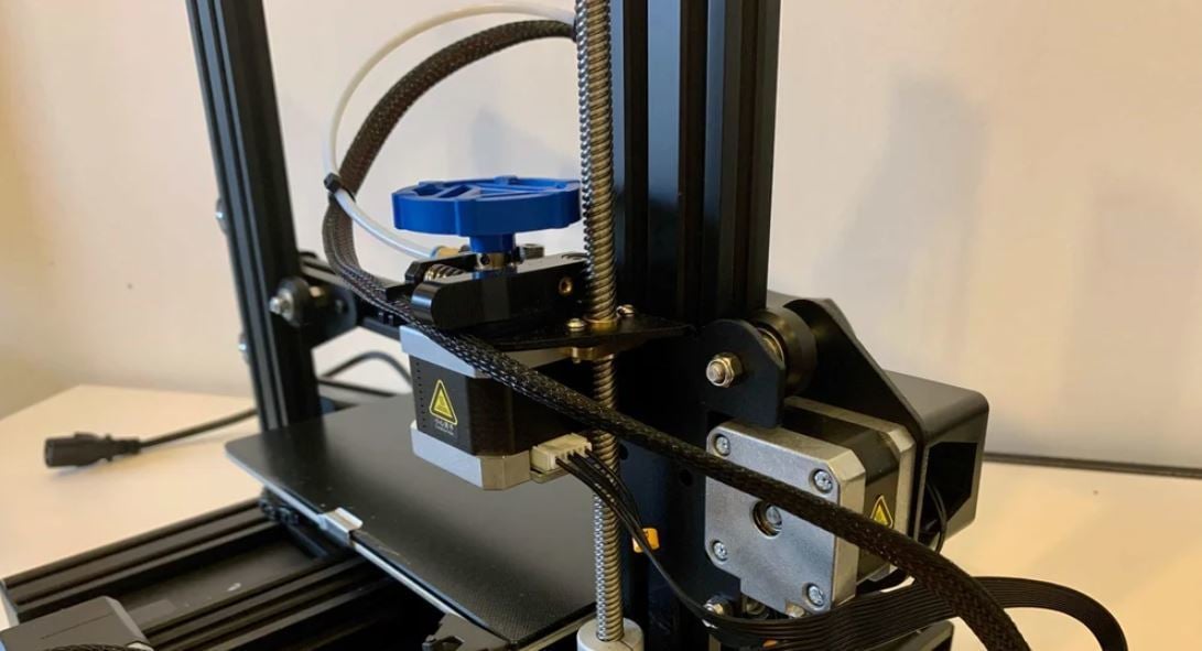 If you have an Ender 3 V2, you can rotate the extruder knob to easily push and pull filament