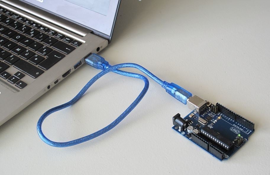 Just connect an Arduino and upload GRBL.
