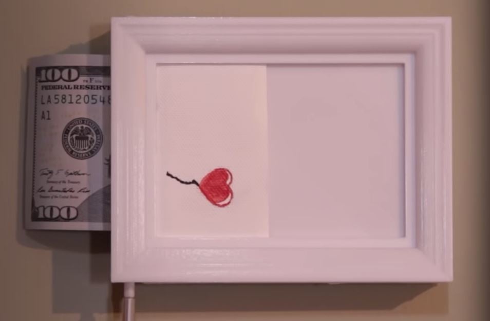 This trick frame looks like any other picture frame, but can turn the picture into money!