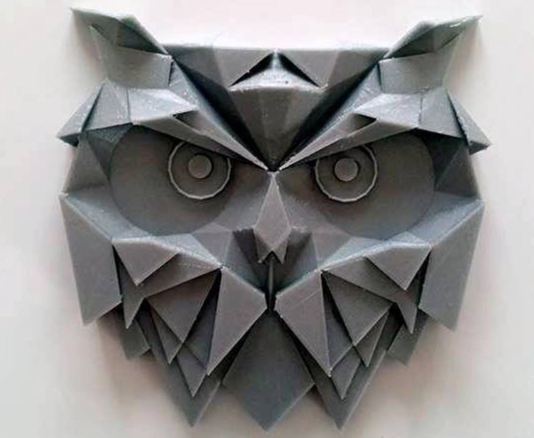 This owl art piece uses geometric shapes to display detail
