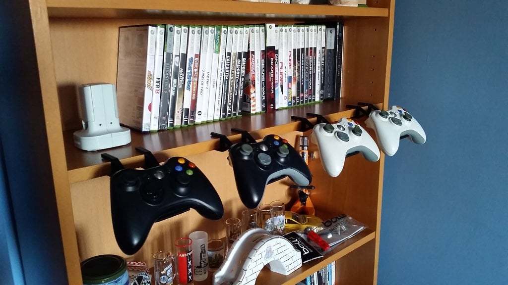 A simple and effective games controller holder for a Billy bookcase