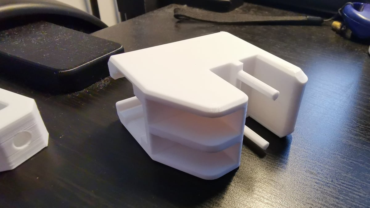 This belt tensioner uses a few different printable parts, a pulley, and some other hardware