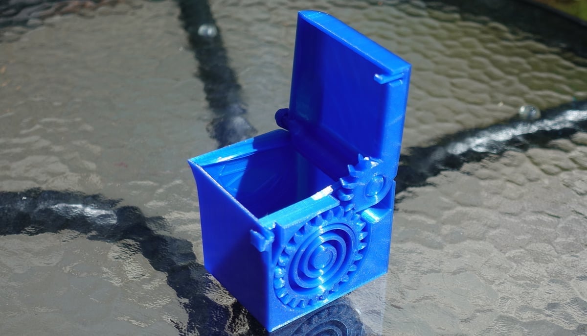 A 3D printed, spring-loaded, print-in-place box