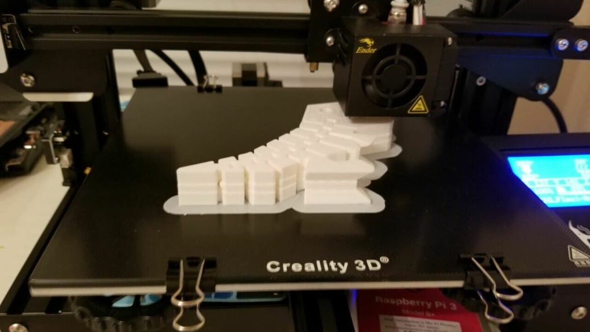 You can use binder clips to secure your build plate to your printer's frame