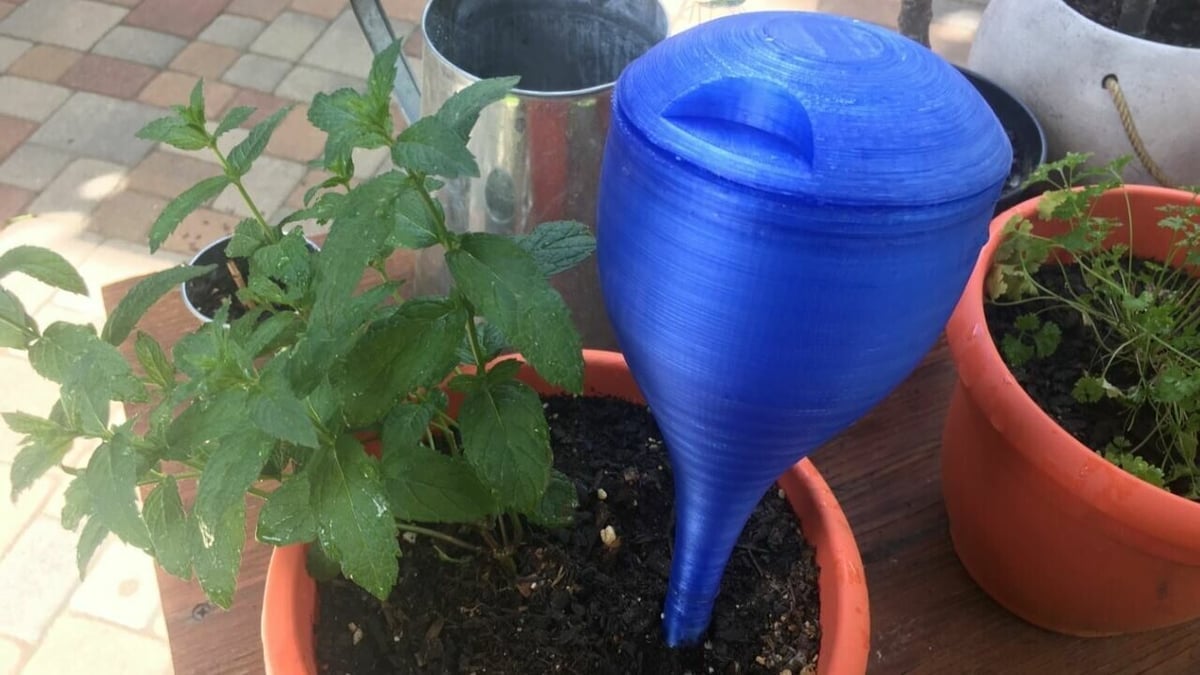 This watering stake has a removable lid that lets you refill the container without having to remove it from the soil