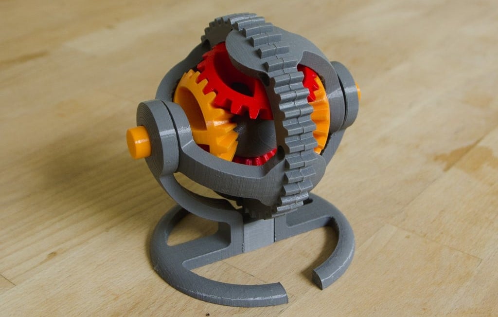 This mechanism uses an array of special gears to spin the center spherical shape