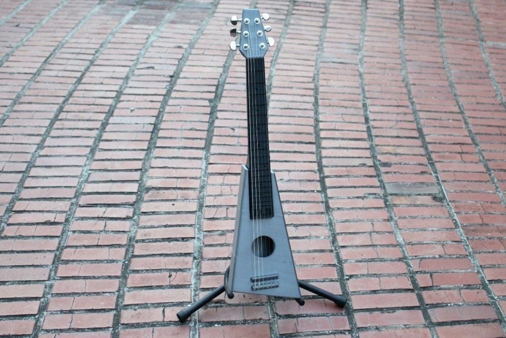 This guitar is about a 3/4 scale to a real guitar