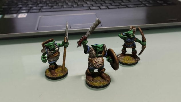 A trio of orcs of different forms