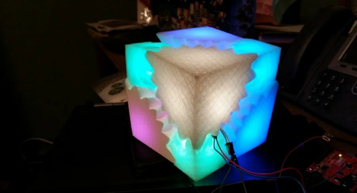The BlinkyCube was made with an Arduino Nano, RGB LEDs, and a 3D printable gear-shaped model