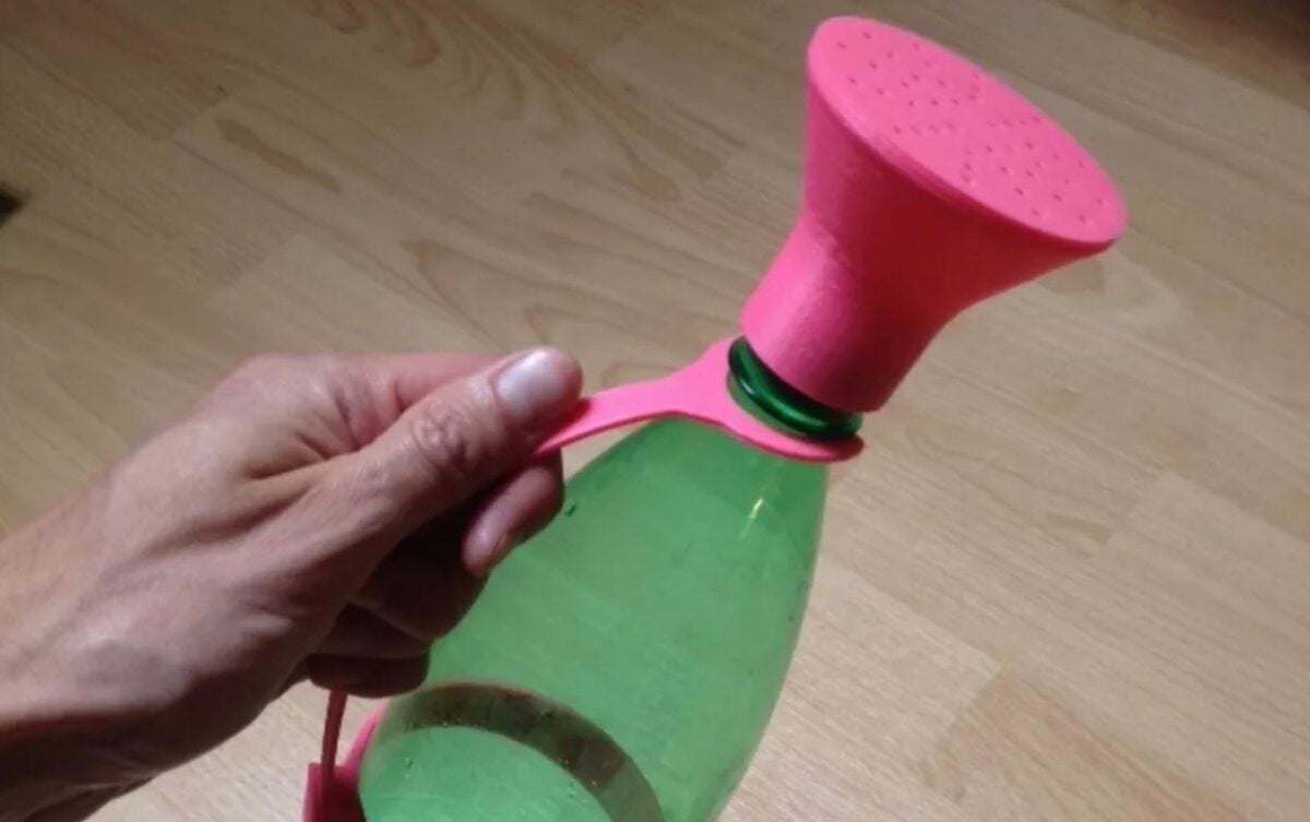 A simple design to convert a soda bottle to a watering can