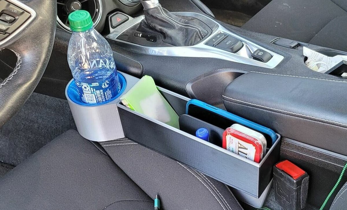 This organizer has a cup holder and rectangular holding space