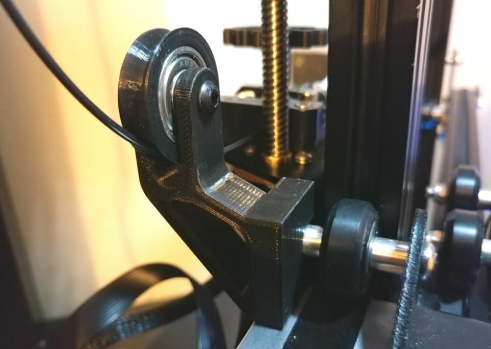 This filament guide uses a bearing to ensure a smooth filament path