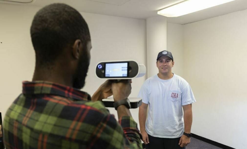 A scanning device like a 3D scanner or cell phone can be used