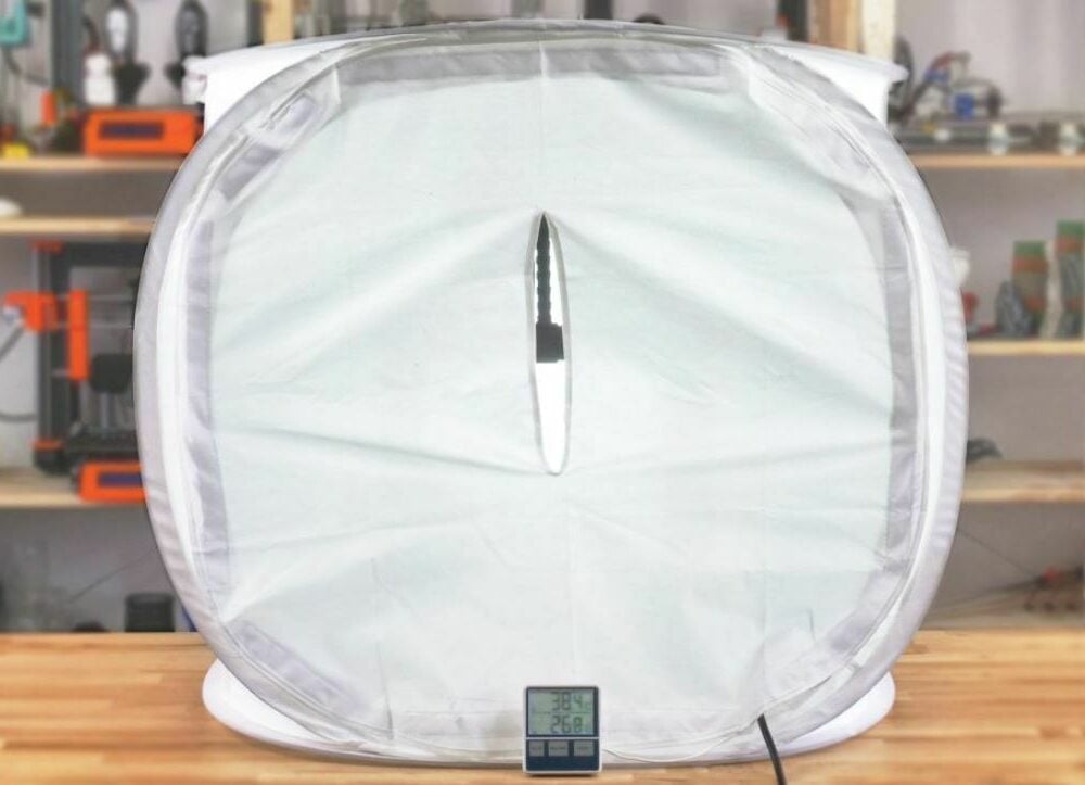 Most photo tents have a zipper flap that you can use to access your printer