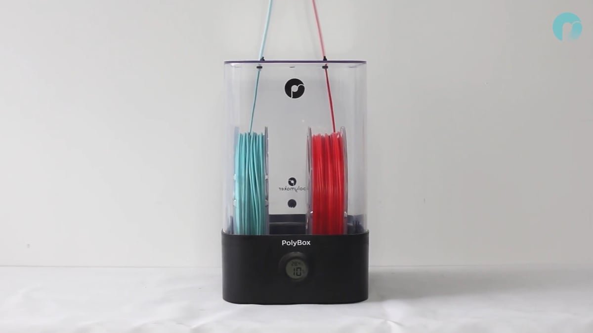The PolyBox II can fit a few spools of filament and has feeder holes so you can use the stored materials