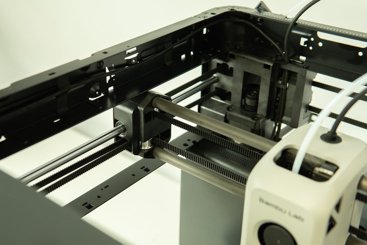 CoreXY printers use two belts that loop around pulleys at different ends of the corresponding gantries