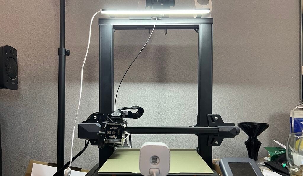 You can attach lights to your printer with an overhead mount