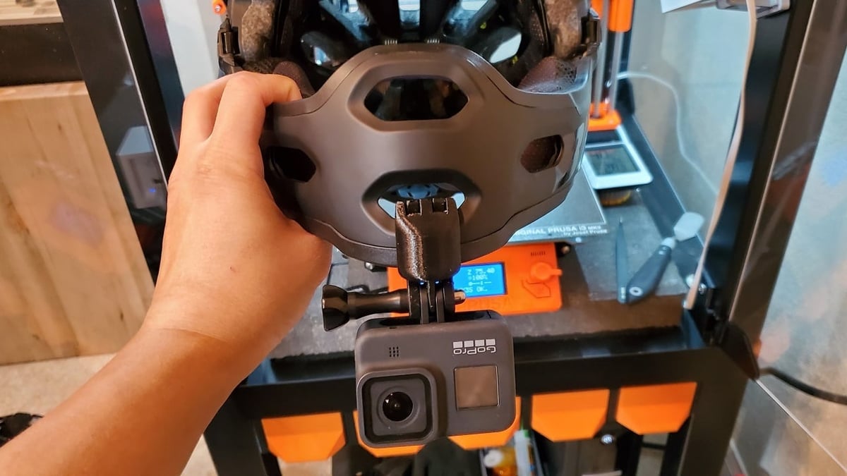 You can attach a generic GoPro camera mount to the end of this chin mount