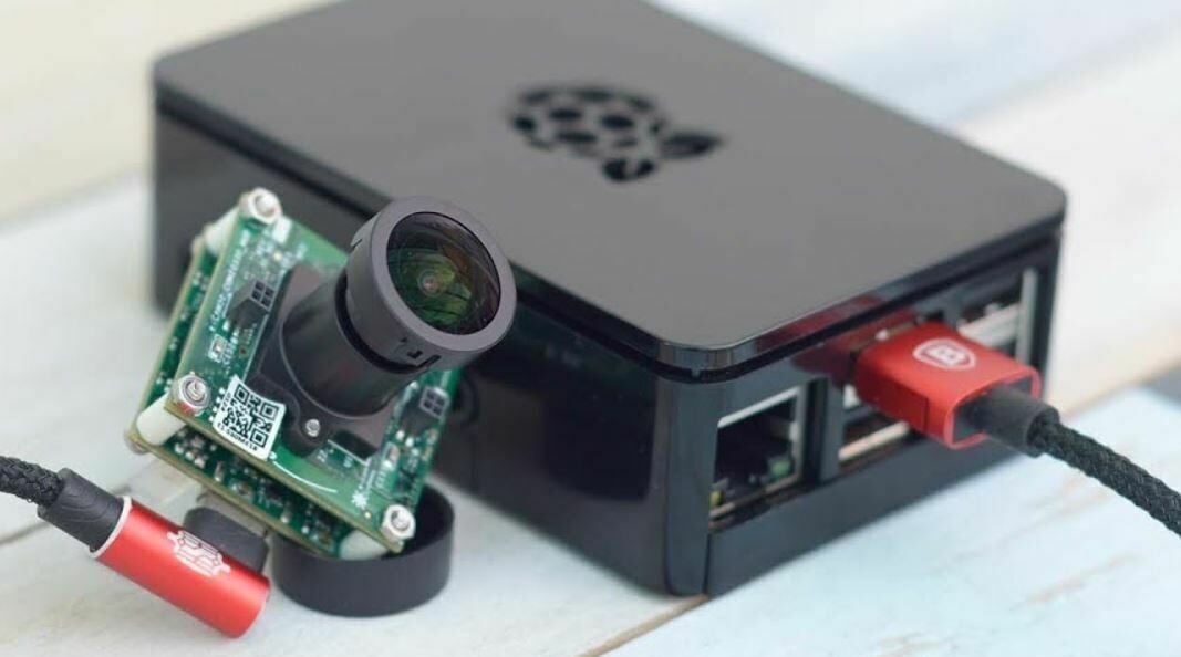 You can plug your webcam into your OctoPrint computer's USB port