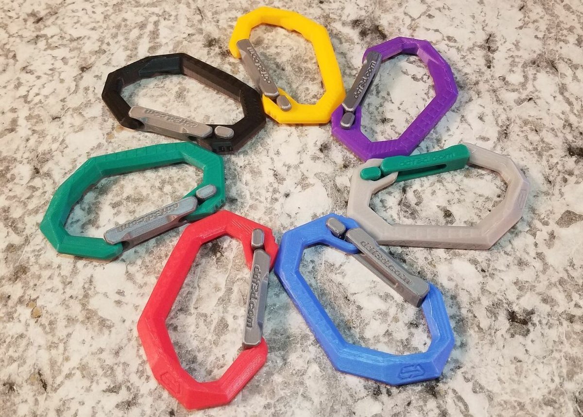 A collection of colorful Origami Carabiners