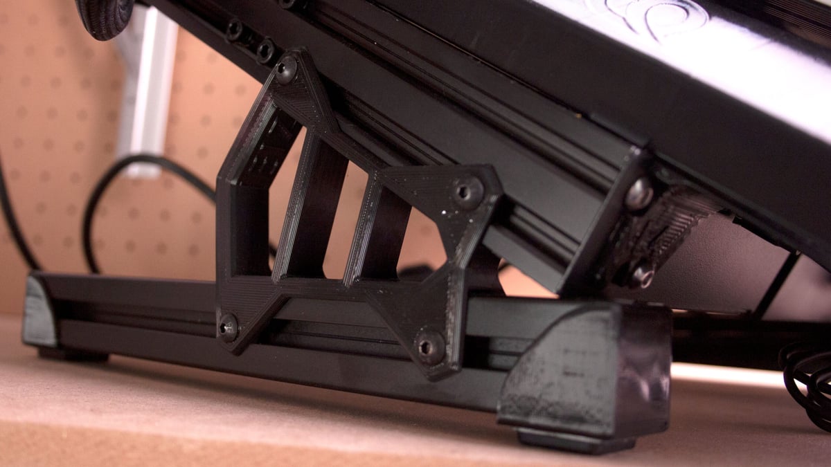 An Ender 3 V2 tilted by an additional extrusion and 3D printed parts.