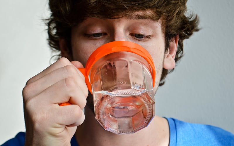 A 3D printed mug handle proving its functionality
