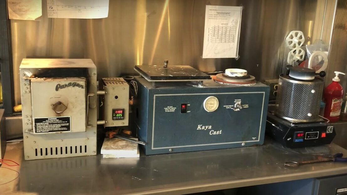 The full casting setup: A kiln, vacuum chamber, and a electric furnace